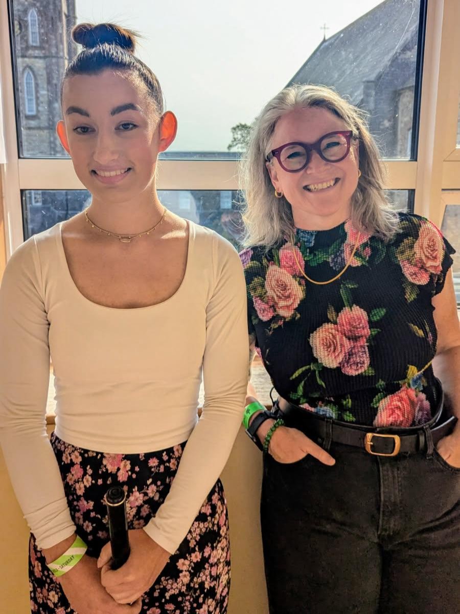 Katya with her whistle instructor Kate Wade just before competing in the u18 whistle solo competition at the Fleadh Cheoil na hÉireann in Wexford, Ireland (August 2025)